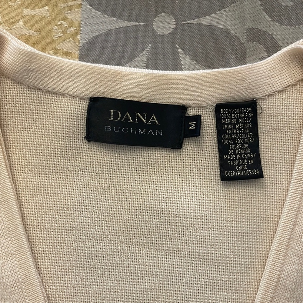 Ladies sweater, cream in color size M, zipper front. Can be dressed up or down .